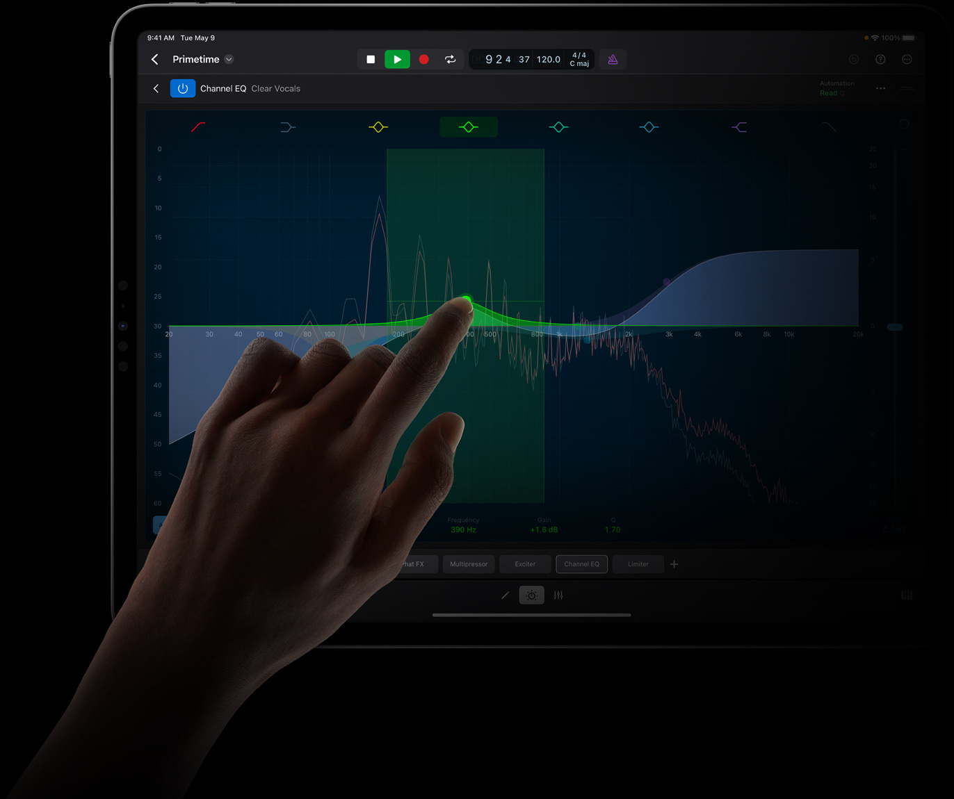 Hand touching an iPad Pro screen to edit a sound wave in Logic Pro for iPad on iPad Pro.