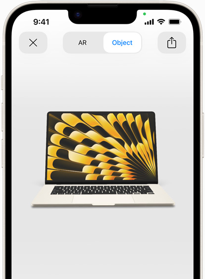 Pratinjau MacBook Air dalam warna Starlight yang ditampilkan dengan AR di iPhone