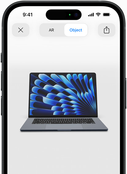 Pratinjau MacBook Air dalam warna Midnight yang ditampilkan dengan AR di iPhone