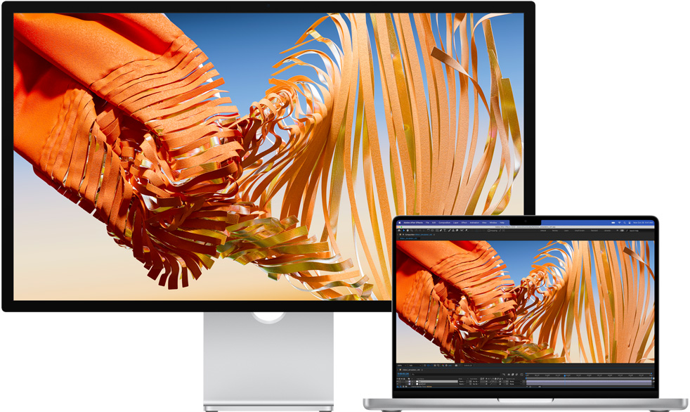 MacBook Pro obok monitora Studio Display