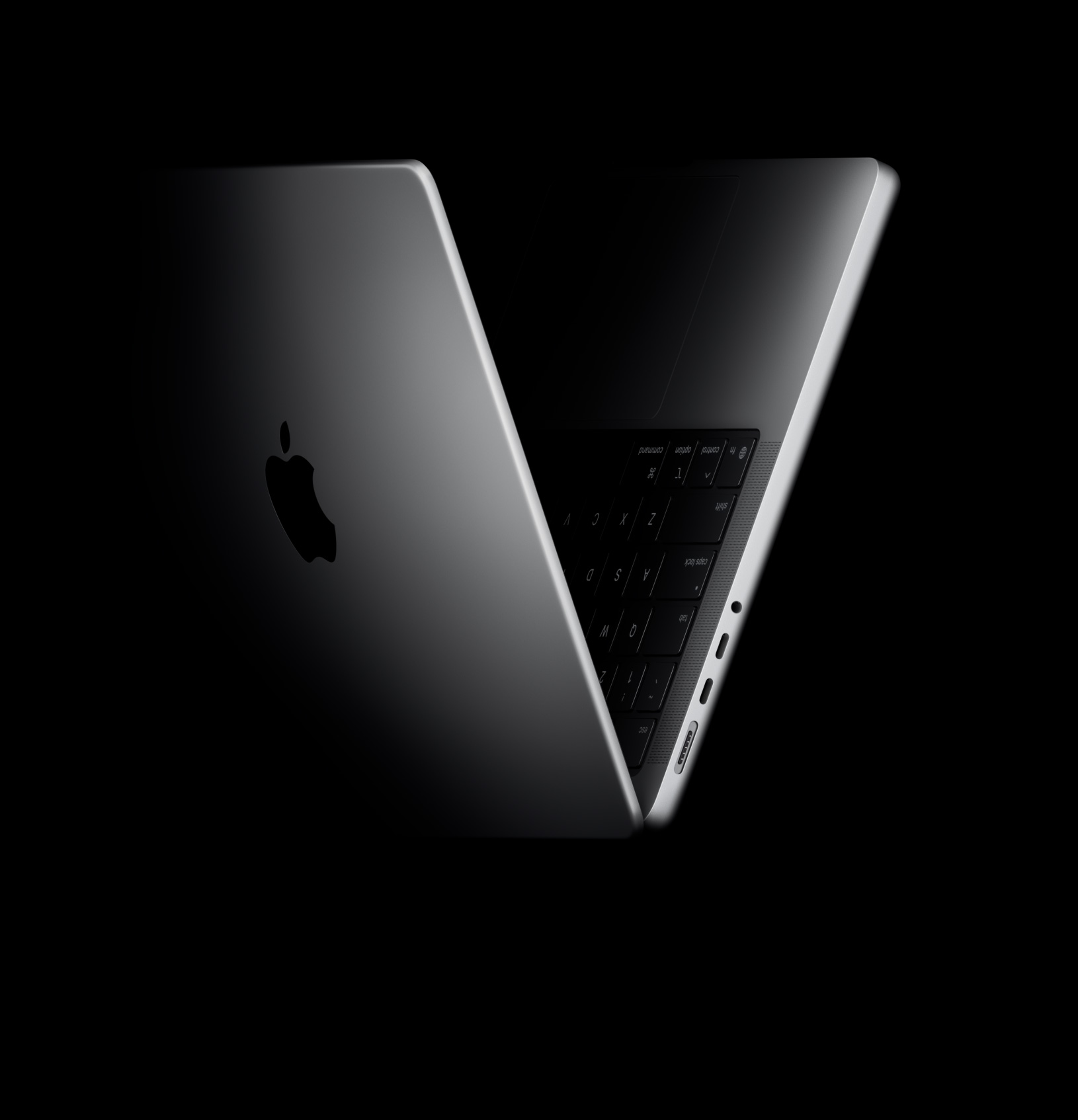 MacBook Pro poziționat în formă de V, făcând referire la cipul M5