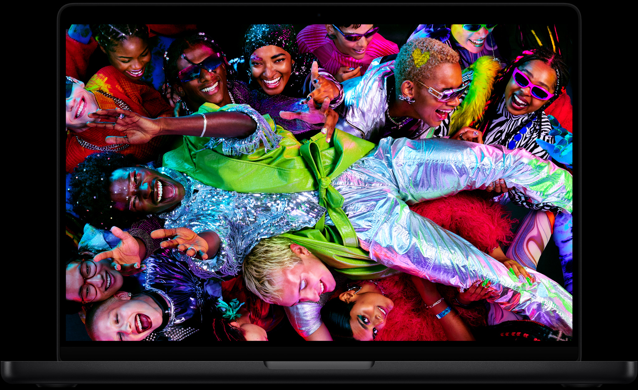 Colourful screen on a MacBook Pro of a person crowd-surfing at a party, showcasing the vibrant Liquid Retina XDR display