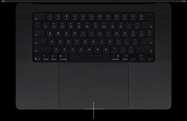MacBook Pro with PROLED XDR Display, space black colour, open, showing keyboard and Force Touch trackpad