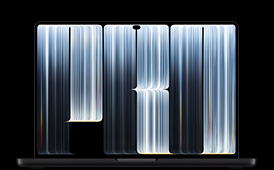 MacBook Pro with PROLED XDR Display, space black colour, open, screen shows ribbonlike objects densely patterned with glowing stripes of various widths, spelling the word Pro