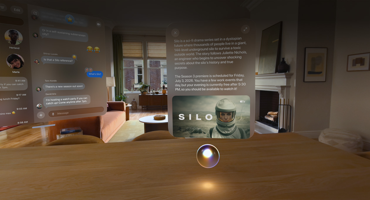 Apple Vision Pro being used in a lounge room, Messages conversation open to the left, Siri hovering over a countertop in front of the user, a window above Siri shows a query and a response