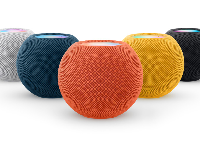 From left to right: one White, one Blue, one Orange, one Yellow, and one Space Gray HomePod mini